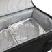 A Sterno Black large insulated food carrier with foil pans inside.