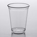 A clear plastic Fabri-Kal cup on a white surface.