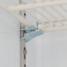 A metal bracket on a metal shelf inside a white Beverage-Air MarketMax glass door refrigerator.