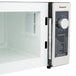 A white Panasonic commercial microwave with a dial and a door open.