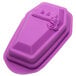 A purple silicone cake mold with a coffin shaped design and the word "R.I.P." in the middle.