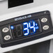 The digital display of a Beverage-Air MMF27HC-1-W-18-IQ glass door merchandiser freezer.