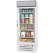 A white Beverage-Air glass door refrigerator full of dairy products with a white jug of milk on the shelf.