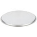 A Vollrath stainless steel domed pan cover on a round silver plate.