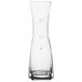A clear glass Spiegelau wine carafe with a small amount of liquid.