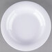 A close-up of a white Carlisle melamine bowl with a curved edge.