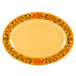 A white oval platter with a yellow and green floral design.