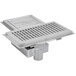 A stainless steel Eagle Group floor trough with a fiberglass grating cover.