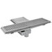 An Eagle Group metal floor trough with a square base and a fiberglass grating cover.