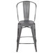 A Flash Furniture distressed silver metal counter height stool with a vertical slat back.
