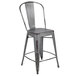 A Flash Furniture metal counter height stool with a slat back and drain hole seat.