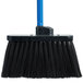 A Carlisle black broom with black unflagged bristles and a blue handle.