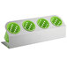 A white and lime green stainless steel flatware organizer with four lime green perforated plastic cylinders.