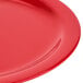 A close-up of a red Carlisle Dallas Ware melamine plate.