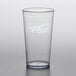 A clear plastic tumbler with a Coca-Cola logo on it.