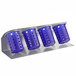 A Steril-Sil stainless steel flatware organizer with purple perforated plastic cylinders on it.