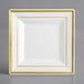 A white square plate with gold trim.