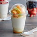 A clear plastic Choice cup filled with fruit yogurt and topped with fruit with a white PET dome lid.