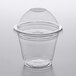 A Choice clear plastic cup with a PET dome lid on a table.