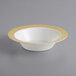 A white bowl with a gold lattice design on it.