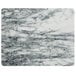 A white marble pastry board with a marbled surface.