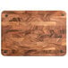 A Fox Run acacia wood cutting board with metal corners.