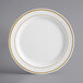 A white Visions plastic plate with gold bands.