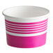A pink and white paper Choice frozen yogurt cup with stripes.