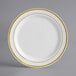 A white plastic plate with gold bands.