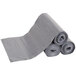A roll of grey Rubbermaid trash can liners.