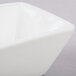An American Metalcraft Prestige square porcelain bowl with a white surface.