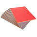 A stack of colored paper including red.