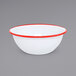 A white bowl with red rim.