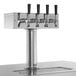 An Avantco stainless steel beer dispenser with four taps.