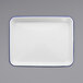 A white rectangular enamelware tray with blue trim.