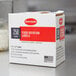 A white box of Cambro StoreSafe dissolvable food rotation labels with red and black text on the counter.