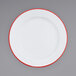 A white Crow Canyon Home enamelware plate with a wide red rim.