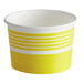 A yellow paper Choice food cup with yellow and white stripes.