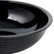 A black Cambro round ribbed bowl.