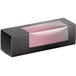 A black Solia box with a clear window and pink plastic inside.