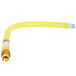 A yellow hose with a yellow and silver gas connector.