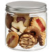 A Solia clear plastic jar filled with a variety of cookies.