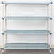 A MetroMax metal shelf with two shelves with holes.