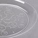 A close up of a clear Fineline Savvi Serve plastic plate with a swirl design.