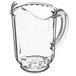 A clear plastic pitcher with a handle and a window.