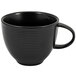 A close-up of a black Front of the House Spiral Ink porcelain coffee cup with a handle.