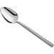 An Acopa Phoenix stainless steel teaspoon with a long silver handle and a silver spoon.