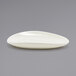 A white oval shaped dish with a scalloped edge.