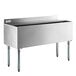 A stainless steel Regency underbar ice bin with sliding lid and bottle holders.