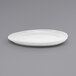 A close-up of a white Front of the House Tides oval porcelain plate.